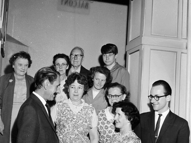 Mrs H McGlinchey receives a cheque after working as a cleaner for 15 years at Edinburgh's Ritz Cinema in August 1964.
