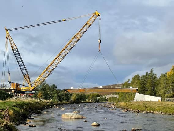 The two main bridge deck beams - each weighing an impressive 100 tonnes - were lifted into place using a Liebherr LG 1550 mobile crane.