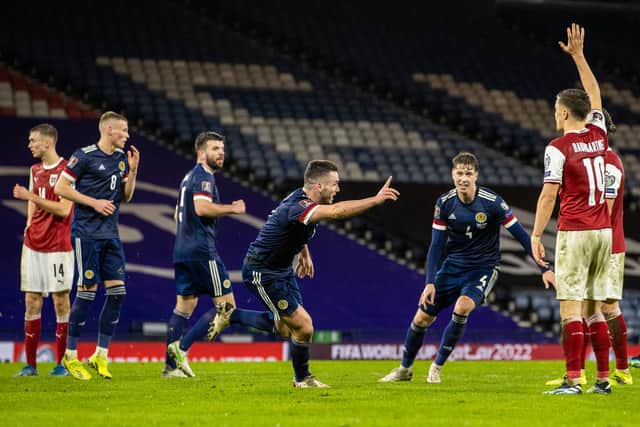 John McGinn celebrates after his overhead kick earned Scotland a 2-2 draw against Austria at Hampden (Photo by Alan Harvey / SNS Group)
