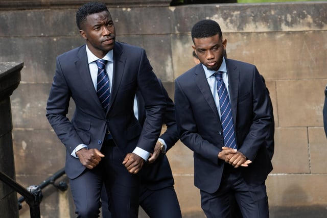 Rangers players Fashion Sakala (L) and Amad Diallo arrive at the funeral of Rangers kitman Jimmy Bell