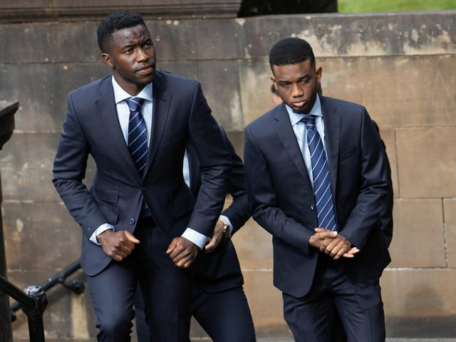 Rangers players Fashion Sakala (L) and Amad Diallo arrive at the funeral of Rangers kitman Jimmy Bell