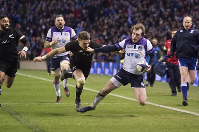 Scotland's Stuart Hogg (right) is tackled by Beauden Barrett late in the game as New Zealand win 22-17 in 2017. Picture: Bill Murray/SNS