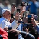 Pope Francis waves from the popemobile car as he makes a tour of St. Peter's square following the Easter Sunday mass. Picture: Andreas Solaro/AFP via Getty Images