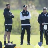 Hibs manager Lee Johnson, centre, talks to his coaches ahead of facing St Johnstone this weekend.