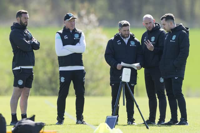 Hibs manager Lee Johnson, centre, talks to his coaches ahead of facing St Johnstone this weekend.