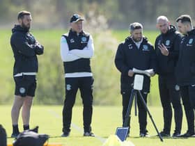 Hibs manager Lee Johnson, centre, talks to his coaches ahead of facing St Johnstone this weekend.