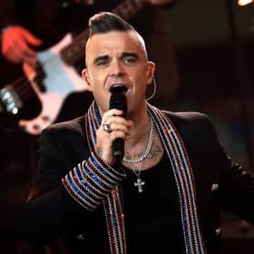 Robbie Williams could drive us willingly back into total lockdown if it meant we could avoid having to listen to his new Christmas song (Picture: Felipe Trueba/pool/Getty Images)