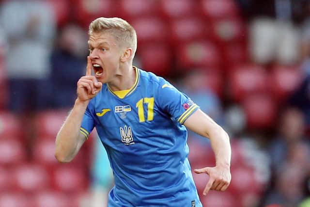 Oleksandr Zinchenko celebrates after scoring for Ukraine at Hampden in their Euro 2020 last 16 victory over Sweden last summer. (Photo by ROBERT PERRY/POOL/AFP via Getty Images)