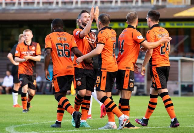 Dundee United's players celebrate after Peter Pawlett put them 4-1 up. Picture: SNS