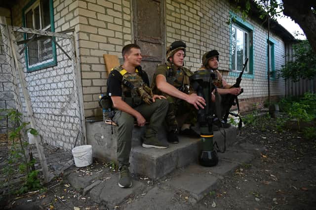 Ukrainian servicemen rest on their position not far from the Ukrainian town of Chuguiv, in Kharkiv region on June 9, 2022. (Photo by SERGEY BOBOK / AFP) (Photo by SERGEY BOBOK/AFP via Getty Images)