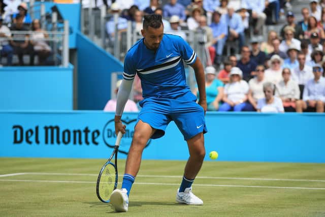Nick Kyrgios of Australia plays a shot between his legs during his singles semi-final match against Marin Cilic of Croatia during day six of the Fever-Tree Championships at Queens Club on June 23, 2018 in London, United Kingdom.