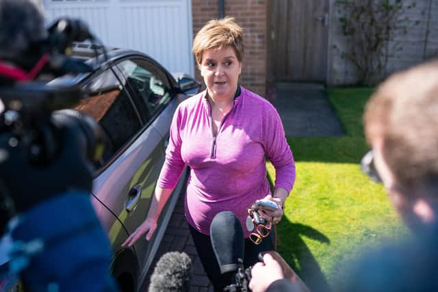 Nicola Sturgeon is quizzed by reporters after the re-arrest of her husband, her appearance at her home prompting cruel comments.