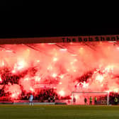 Rangers fans light up the Bob Shankly stand with pyro during a cinch Premiership match against Dundee at Dens Park.  (Photo by Rob Casey / SNS Group)