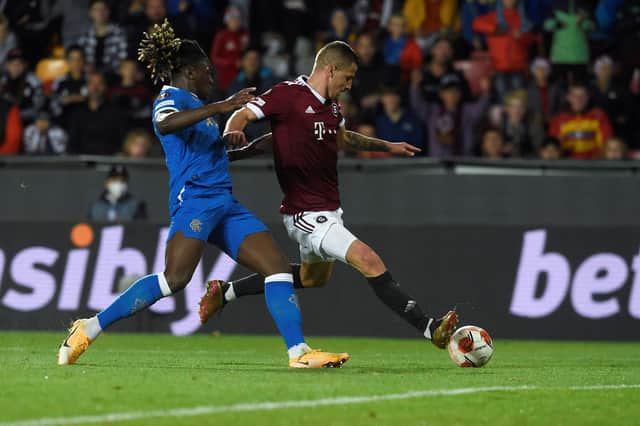 Sparta Prague striker Martin Minchev gets ahead of Rangers defender Calvin Bassey to fire a shot on goal during the Europa League Group A match. (Photo by MICHAL CIZEK/AFP via Getty Images)