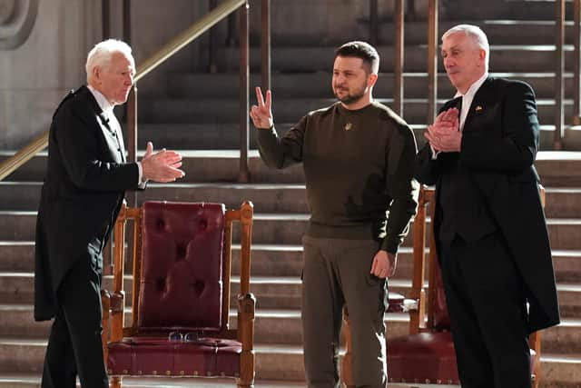 Ukrainian President Volodymyr Zelensky gives a V-for-Victory sign, in the style of Winston Churchill, after addressing politicians in Westminster Hall (Picture: Stefan Rousseau/PA)