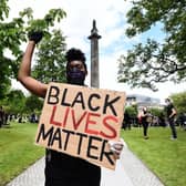 A Black Lives Matter protest at Melville Monument in Edinburgh. Should black history be included in the school curriculum?