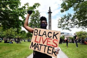 A Black Lives Matter protest at Melville Monument in Edinburgh. Should black history be included in the school curriculum?