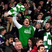 Hibernian fans celebrate during the Premier Sports Cup semi-final match at Ibrox Stadium, Glasgow. They will head to Hampden Park today.