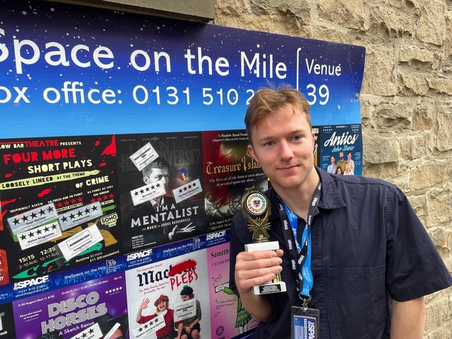 Angus with his Derek Award at last year's Edinburgh Fringe Festival.