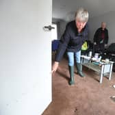 Jean Hendrie and William Craik cleaning their house in Pyothall Court in Broxburn, West Lothian after flooding.