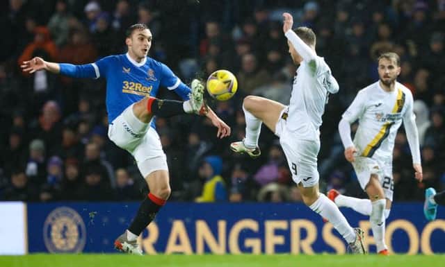 Rangers midfielder James Sands (left) challenges Livingston striker Bruce Anderson during Wednesday's Premiership match at Ibrox. (Photo by Alan Harvey / SNS Group)