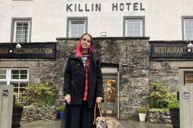 Anfisa Ihnatova, 19, with her dog, Layla, outside their new home at the Killin Hotel. PIC: Contributed.