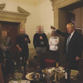 The then prime minister Boris Johnson (right) at a leaving gathering in the vestibule of the Press Office of 10 Downing Street, London,.
