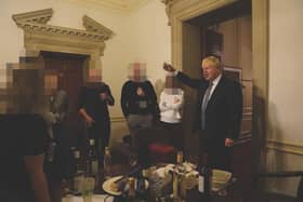 The then prime minister Boris Johnson (right) at a leaving gathering in the vestibule of the Press Office of 10 Downing Street, London,.