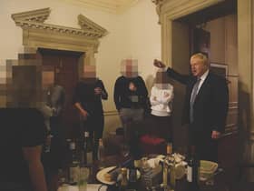 The then prime minister Boris Johnson (right) at a leaving gathering in the vestibule of the Press Office of 10 Downing Street, London,.