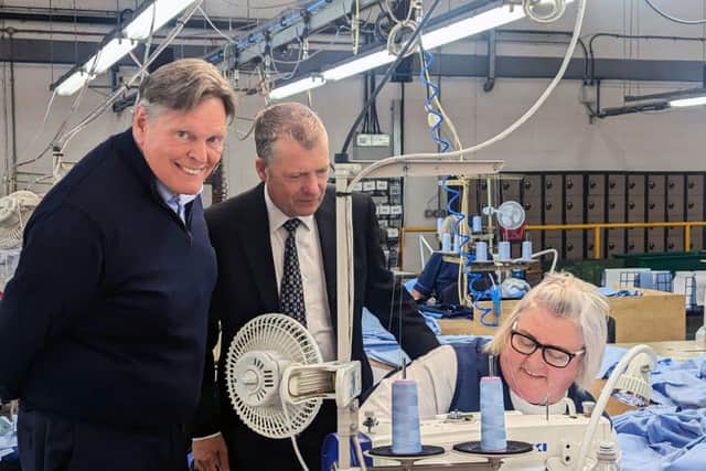 MSPs Stephen Kerr, left and Graham Simpson with Haven Products worker Mary White.