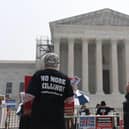 Death penalty protesters demonstrate outside the US Supreme Court in Washington, DC, in June.