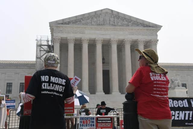 Death penalty protesters demonstrate outside the US Supreme Court in Washington, DC, in June.