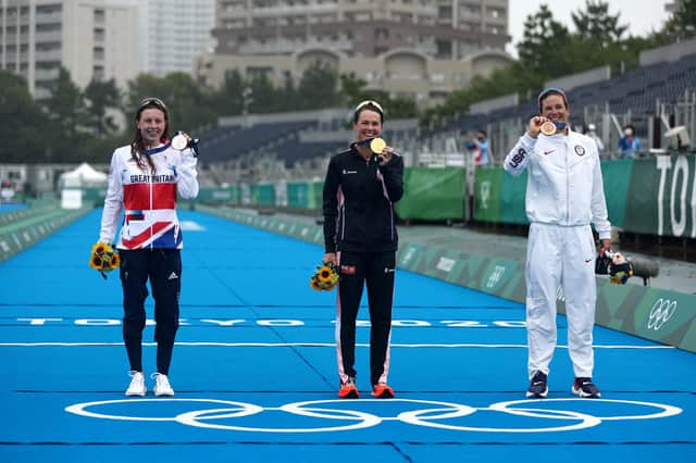 Georgia Taylor-Brown, Flora Duffy and Katie Zaferes pose with their medals after the Women's Individual Triathlon