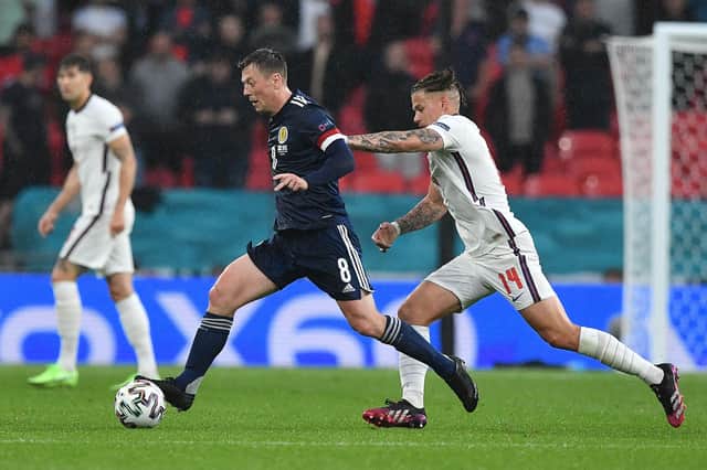 Scotland's Callum McGregor holds off England's Kalvin Phillips during the EURO 2020 Group D match at Wembley (Photo by JUSTIN TALLIS / POOL / AFP) (Photo by JUSTIN TALLIS/POOL/AFP via Getty Images)