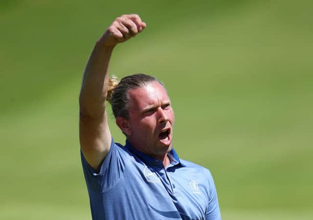 Marcel Siem celebrates his putt on the 18th hole after finishing the second round with a birdie in the 149th Open at Royal St George’s. Picture: Christopher Lee/Getty Images.