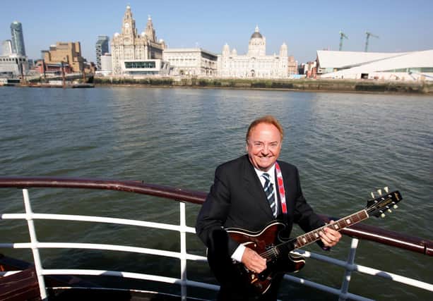 Liverpool singer Gerry Marsden on board the Mersey ferry which he made famous with his song Ferry Across The Mersey with his band Gerry and the Pacemakers.