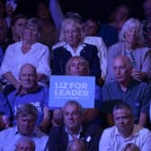 Audience members hold placards showing support for each candidate, on August 01, 2022 in Exeter, England. Conservative Party Leadership hopefuls Liz Truss and Rishi Sunak will attend the second party membership hustings in Exeter this evening.  (Photo by Finnbarr Webster/Getty Images)