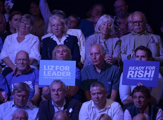 Audience members hold placards showing support for each candidate, on August 01, 2022 in Exeter, England. Conservative Party Leadership hopefuls Liz Truss and Rishi Sunak will attend the second party membership hustings in Exeter this evening.  (Photo by Finnbarr Webster/Getty Images)