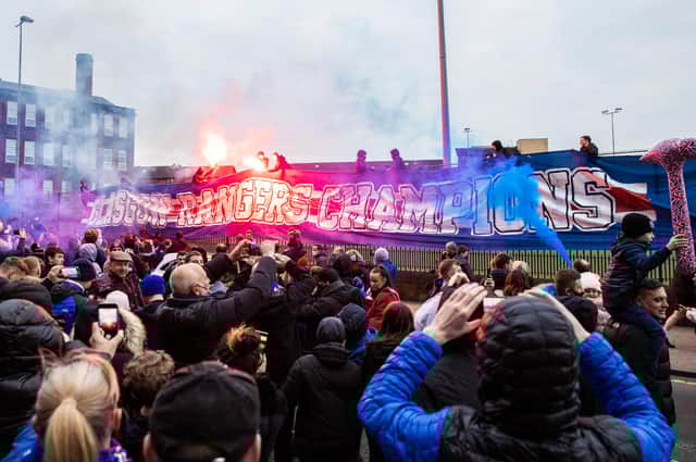 Rangers fans celebrate at Ibrox on Saturday after their team defeated St Mirren to move closer to the title. Picture: SNS