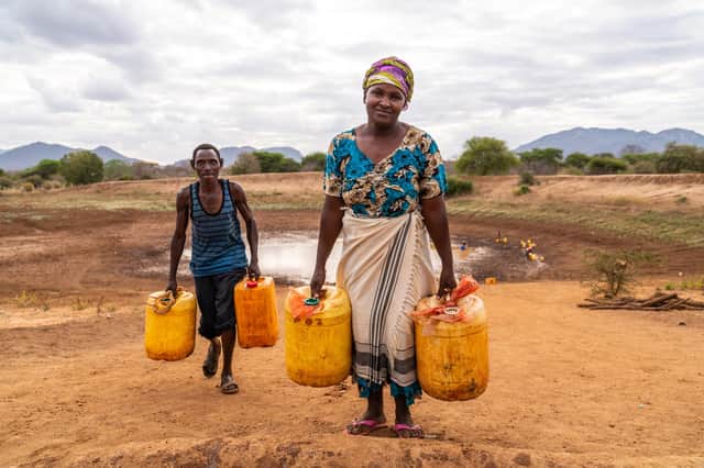 Justine lives with her husband and five children near the Kalikuvu earth dam in Kitui, south Kenya, where communities vulnerable to the impact of climate change are struggling with prolonged periods of drought and erratic heavy rainfall. Picture by Adam Finch