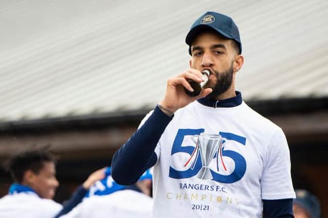 Connor Goldson celebrates outside the Rangers training ground on Sunday after the Ibrox club were confirmed as the new Premiership champions. (Photo by Ross MacDonald / SNS Group)