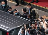 Stand News editor-in-chief Patrick Lam is taken away after police searched the offices of the independent news outlet in Hong Kong (Picture: Anthony Kwan/Getty Images)