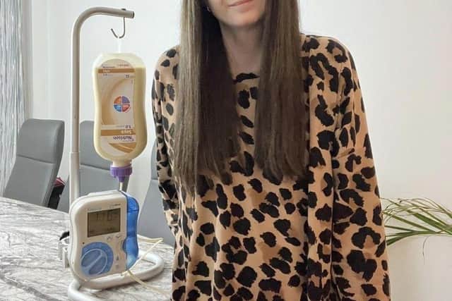 Danielle Alexander with the PEG machine she needs at night to feed her through a tube