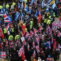 Pro-independence protesters with Scottish Saltire flags (top) march for Scottish independence. Picture: Andy Buchanan/AFP via Getty Images
