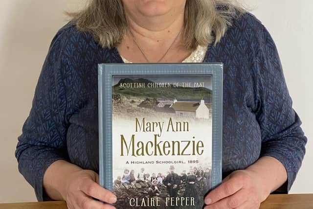 Author and teacher Claire Pepper with a copy of Mary Ann Mackenzie, a Highland Schoolgirl 1895. PIC: Contributed.