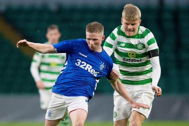 Rangers' Stephen Kelly competes with Stephen Welsh as the Old Firm under-20s meet in the Glasgow Cup (Picture: SNS)