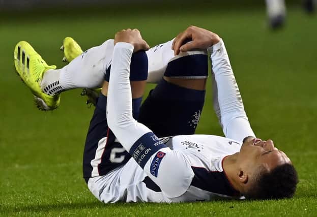 Rangers captain James Tavernier in clear distress after suffering a knee injury which saw him limp out of his team's dramatic 4-3 win over Royal Antwerp in Belgium. (Photo by DIRK WAEM/BELGA/AFP via Getty Images)