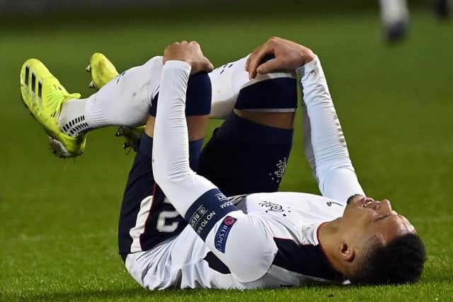 Rangers captain James Tavernier in clear distress after suffering a knee injury which saw him limp out of his team's dramatic 4-3 win over Royal Antwerp in Belgium. (Photo by DIRK WAEM/BELGA/AFP via Getty Images)