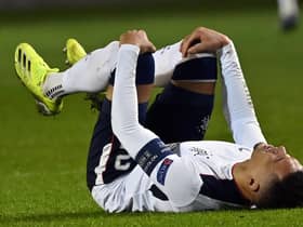 Rangers captain James Tavernier in clear distress after suffering a knee injury which saw him limp out of his team's dramatic 4-3 win over Royal Antwerp in Belgium. (Photo by DIRK WAEM/BELGA/AFP via Getty Images)