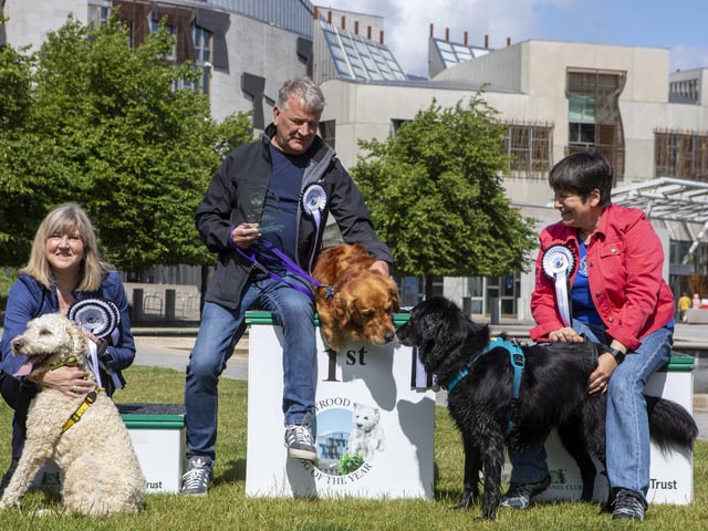Buster, the six-year-old Golden Retriever, and owner David Torrance MSP won the Dog of the Year competition. Second place Kura is an eight-year-old Flat Coated Retriever and is pictured with owner Tess White MSP, while third place went to Oakley from Dogs Trust with Presiding Officer Alison Johnstone. Picture: SWNS